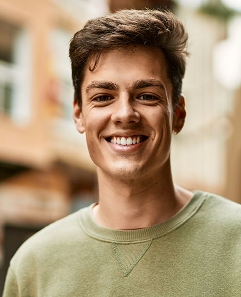 Man in light green shirt smiling
